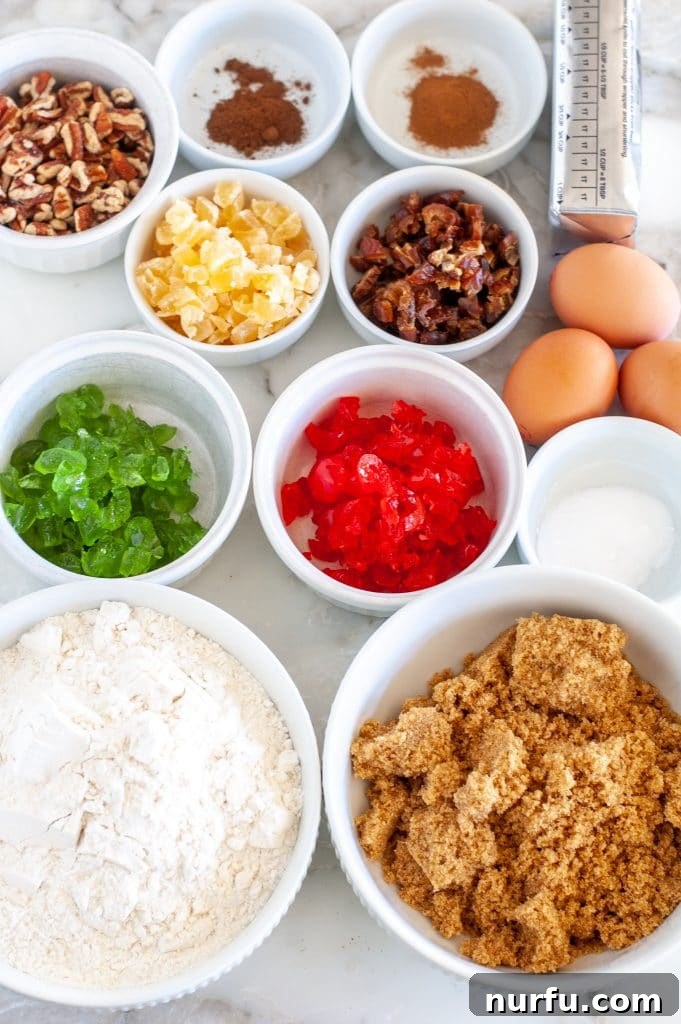 A vibrant display of fresh ingredients: flour, rich brown sugar, colorful candied cherries, crunchy nuts, sweet pineapple, eggs, and shortening, all ready for baking delicious fruitcake cookies.