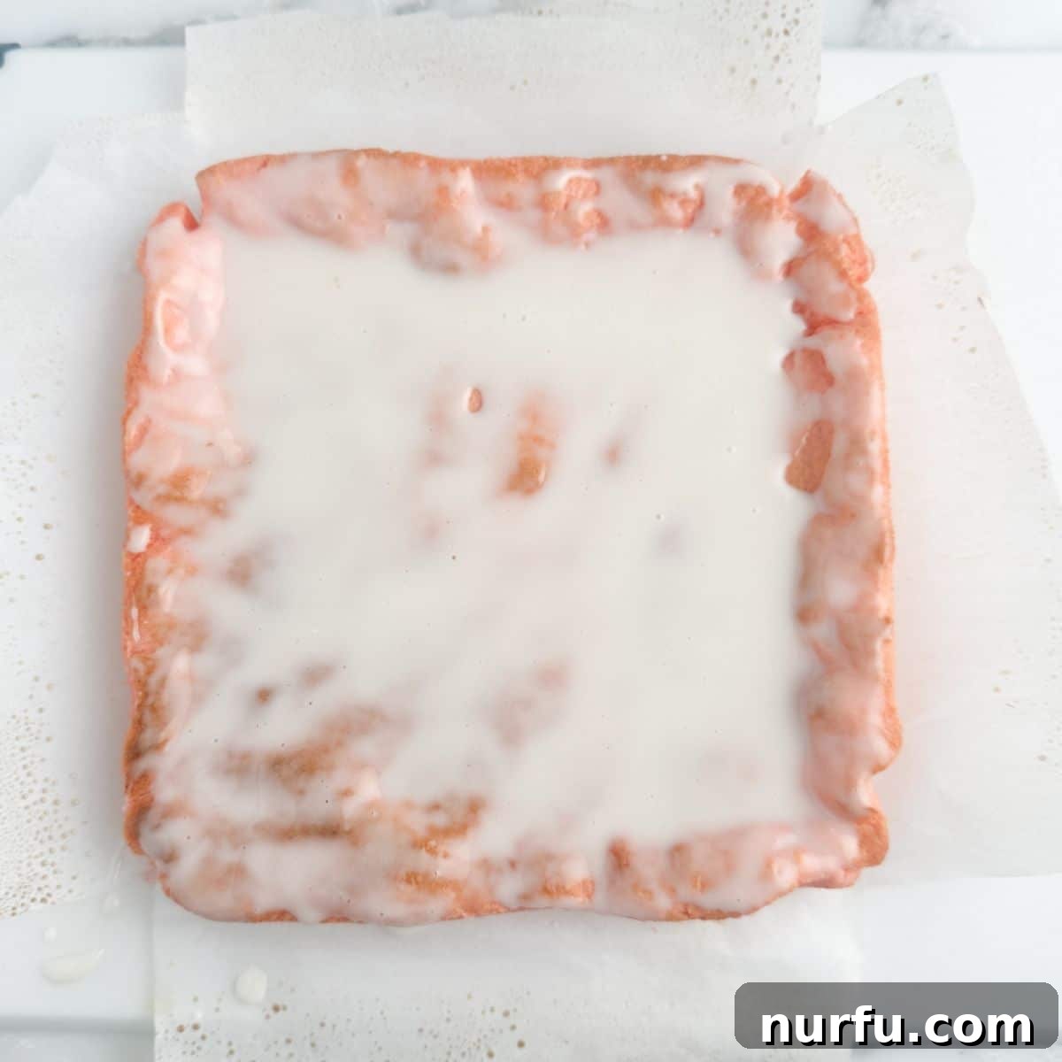 Effortless Strawberry Cake Mix Squares 7 Strawberry bars with a glaze.