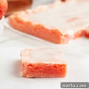 Piece of strawberry bar with glaze on top.