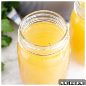 How To Make Rotisserie Chicken Stock Using Your Stove Instant Pot Or Slow Cooker 2 Jar of homemade chicken stock.