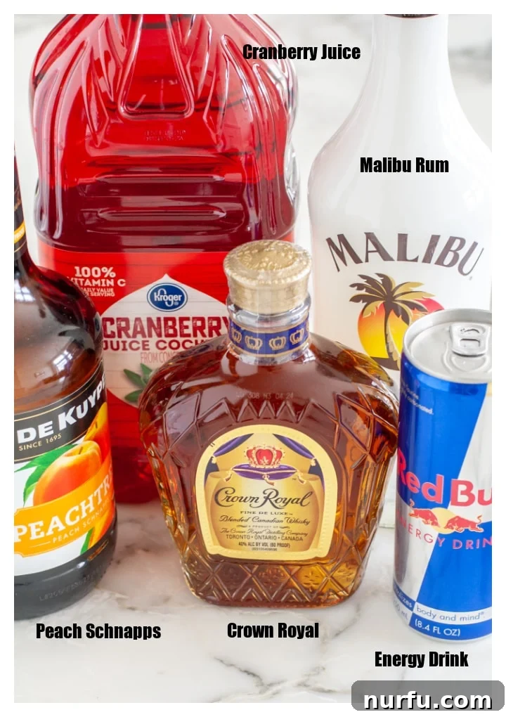 Ignite Your Night: The Vegas Bomb Cocktail 3 Carefully arranged bottles of whisky, peach schnapps, coconut rum, alongside a can of energy drink and a bottle of cranberry juice, showcasing all the ingredients for a Vegas Bomb shot.