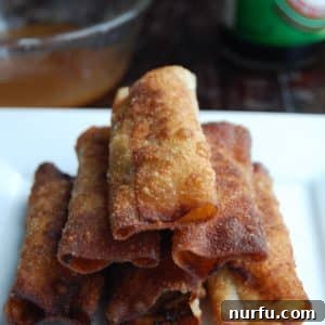 Crispy Vietnamese Spring Rolls with Tropical Pineapple Dip 8 Stacked lumpia on plate.