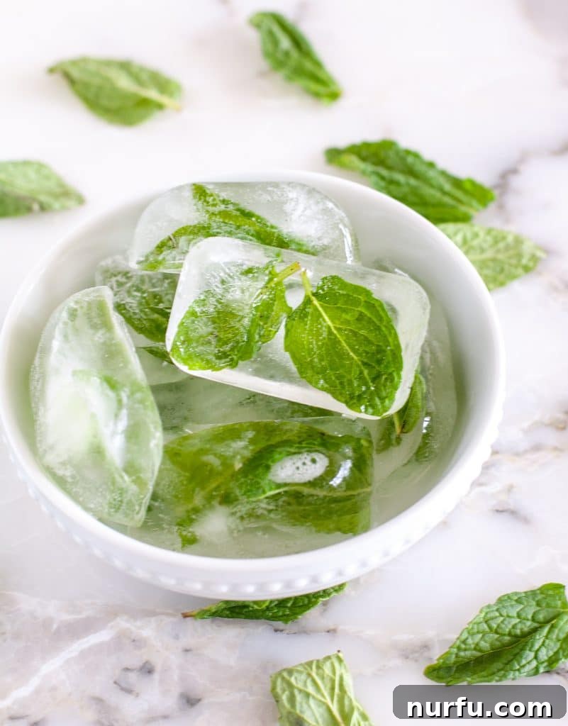 How to Freeze Fresh Mint Leaves 5 A bowl of vibrant green mint ice cubes, showcasing preserved mint.