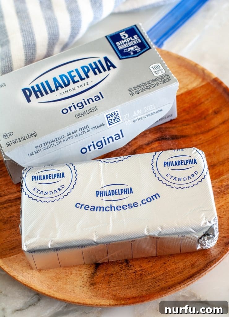 Freezing Cream Cheese What You Need to Know 2 Block of cream cheese on a plate.
