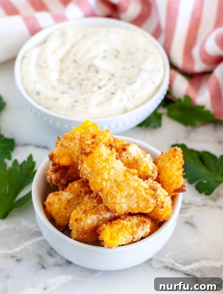 Crispy Air-Fried Cheese Bites 2 Bowl with crispy cheese curds and bowl of ranch.