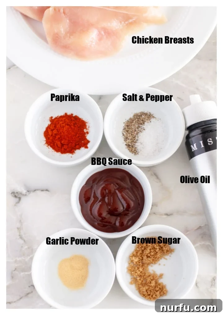 Quick and Juicy Air Fryer BBQ Chicken Breasts in 20 Minutes 3 Bowl of bbq sauce, spices, plate of chicken and oil mister.