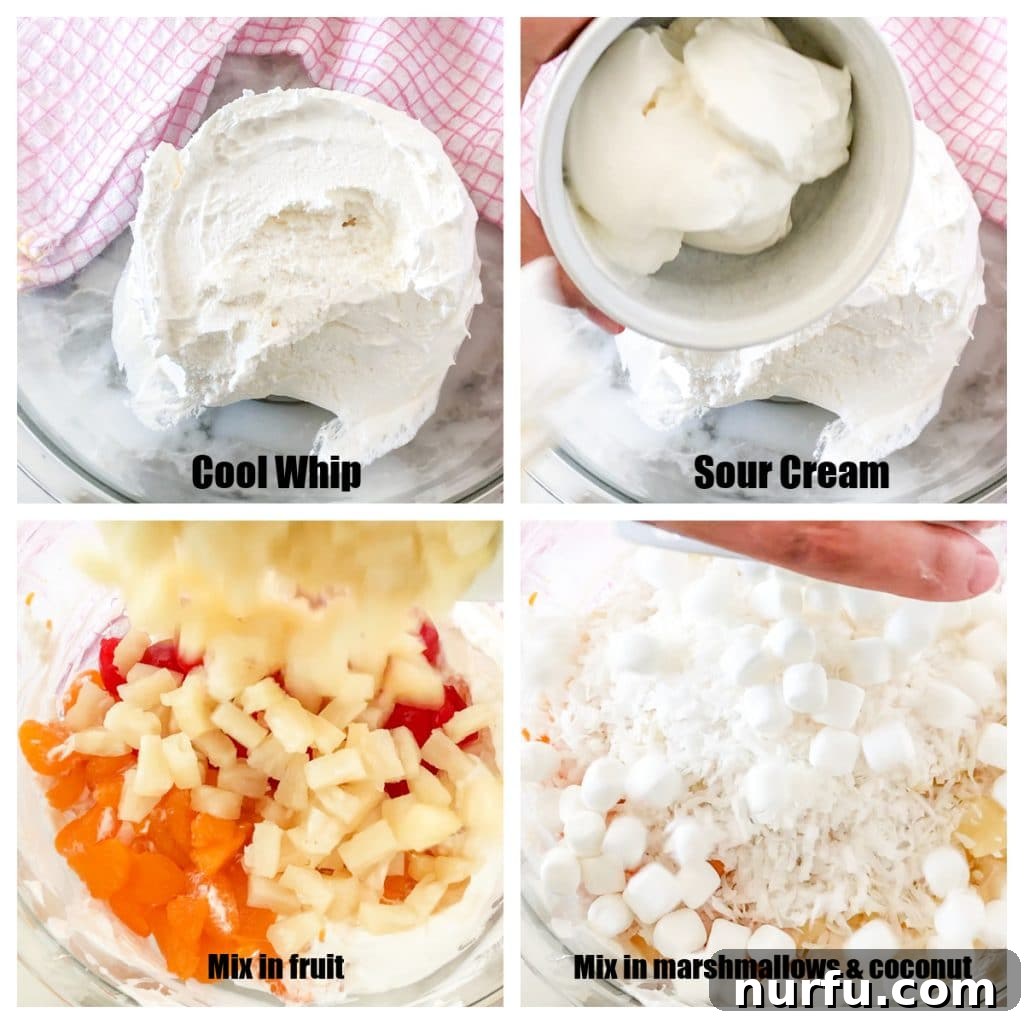 Heavenly Ambrosia Fluff 4 A large mixing bowl filled with the combined ingredients of Cool Whip, sour cream, various fruits, coconut, and mini marshmallows, showcasing the process of making Ambrosia Salad.