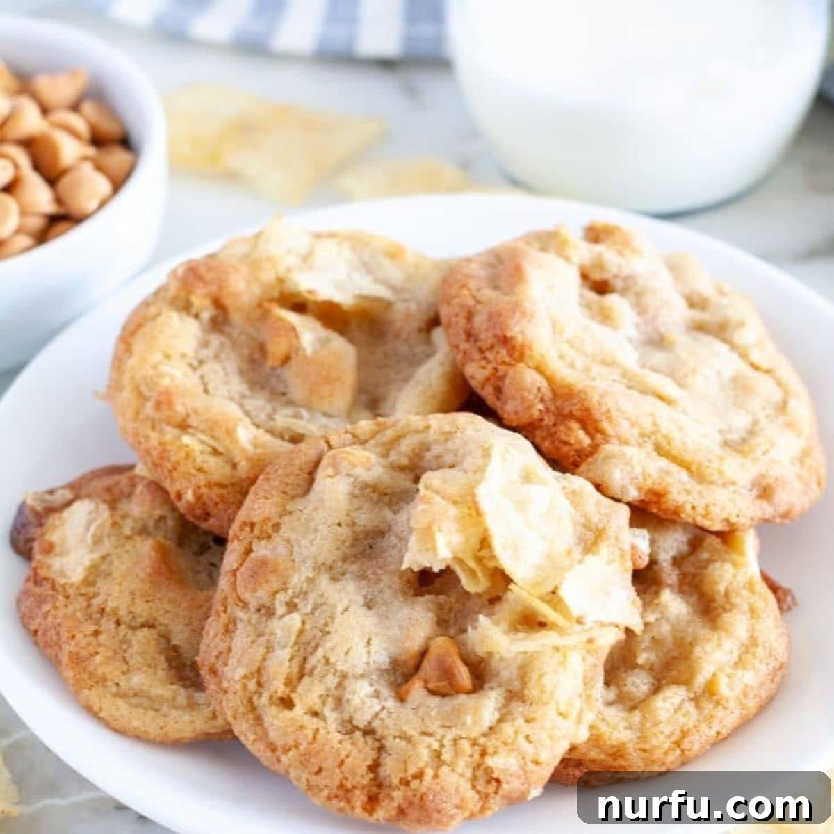 Salty Sweet Chip Crunch Cookies 2 Plate of golden-brown potato chip cookies, showcasing their unique texture and butterscotch chips.