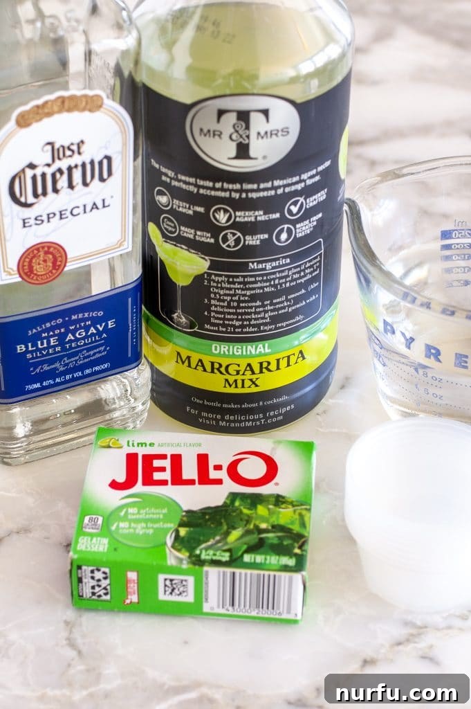 Ultimate Tequila JELL-O Shots 3 A bottle of tequila, margarita mix, and a packet of lime JELLO, the core ingredients for JELLO shots.