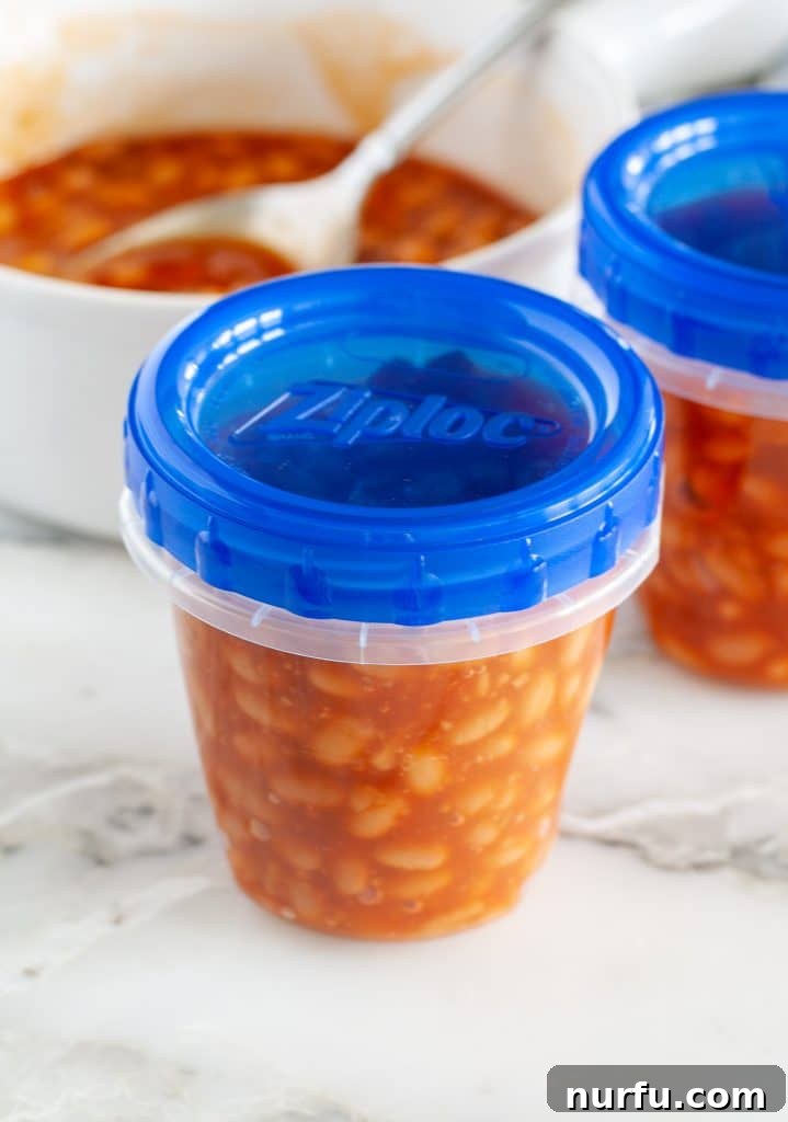 How to Freeze Baked Beans 3 A transparent plastic container filled with defrosted baked beans, ready for reheating.