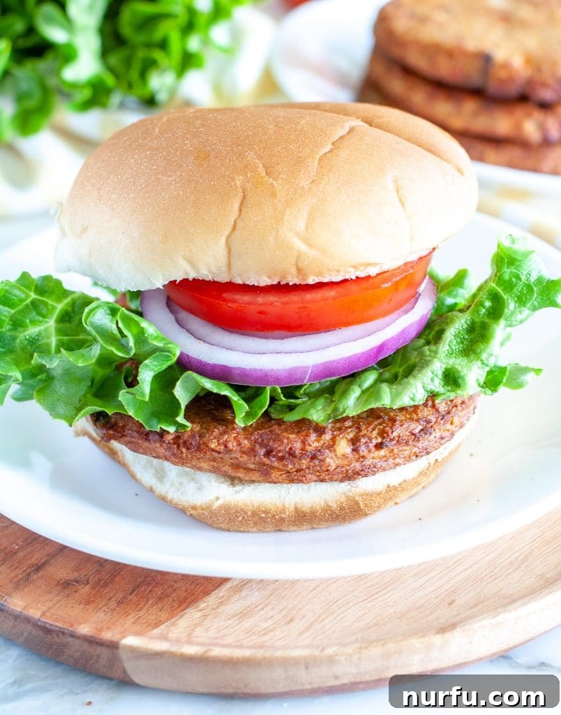 Crispy Air Fryer Frozen Veggie Burgers 2 Burger on a plate, perfectly cooked in an air fryer.