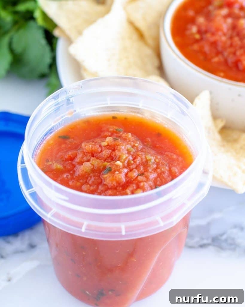 Your Guide to Freezing Salsa 2 Container with salsa, ready for freezing.