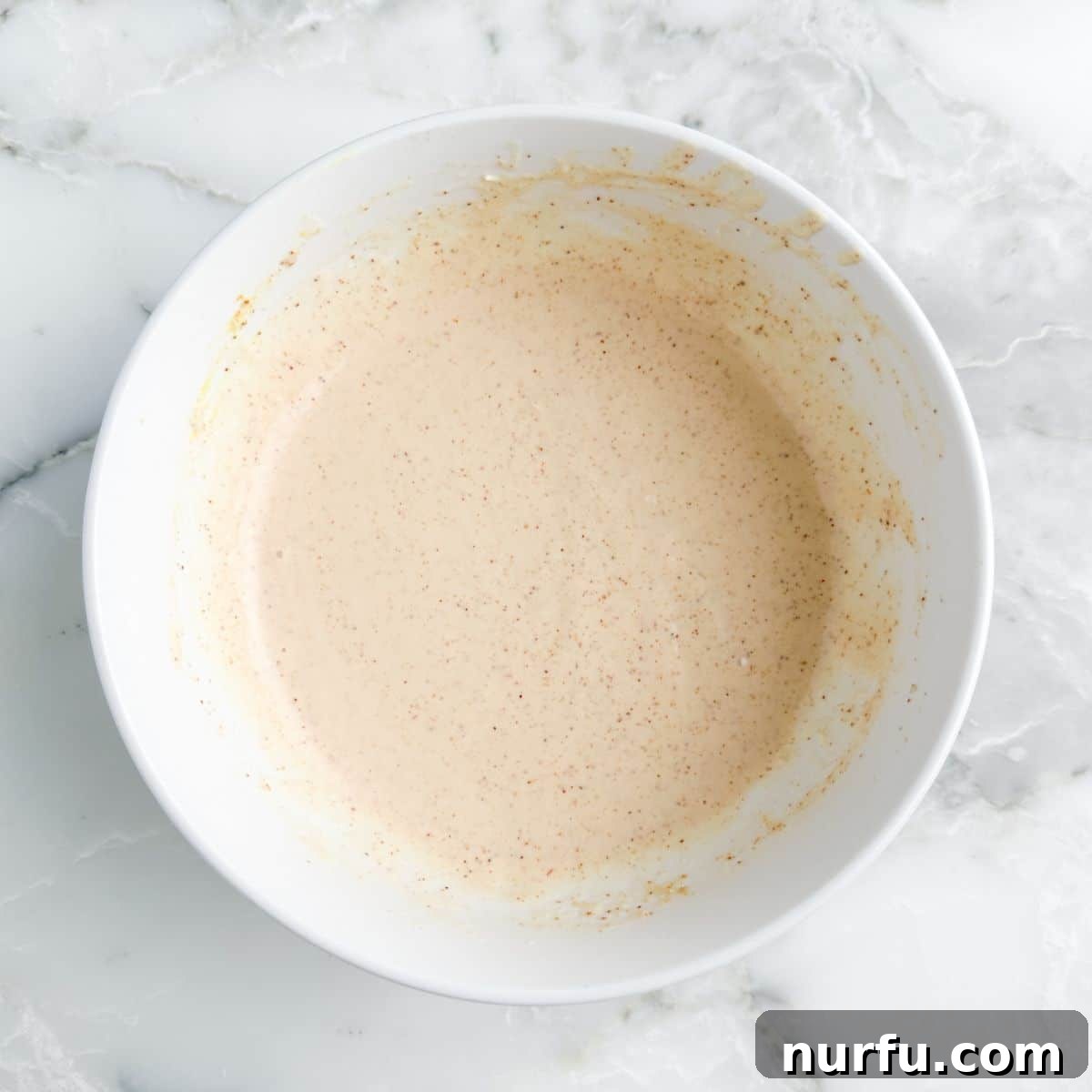 Burger King Signature Zesty Dip 5 A bowl showcasing the creamy, reddish-orange Burger King Zesty Sauce, perfectly mixed and ready to chill.