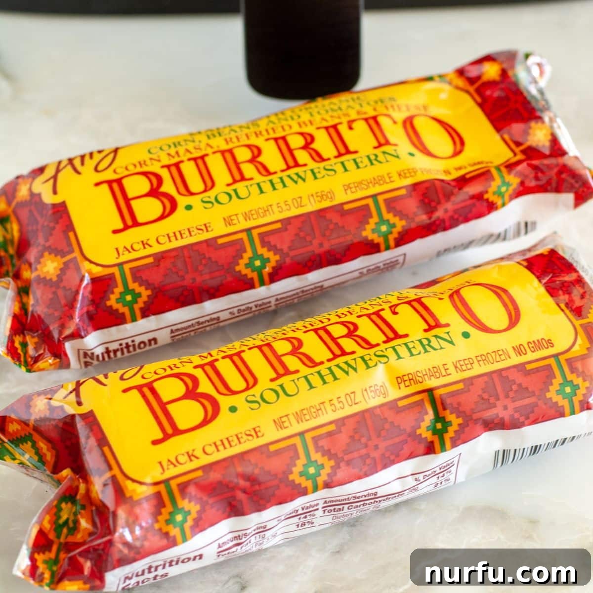 Crispy Air Fryer Frozen Burritos 3 A selection of packaged frozen burritos displayed on a kitchen counter, ready for air frying.