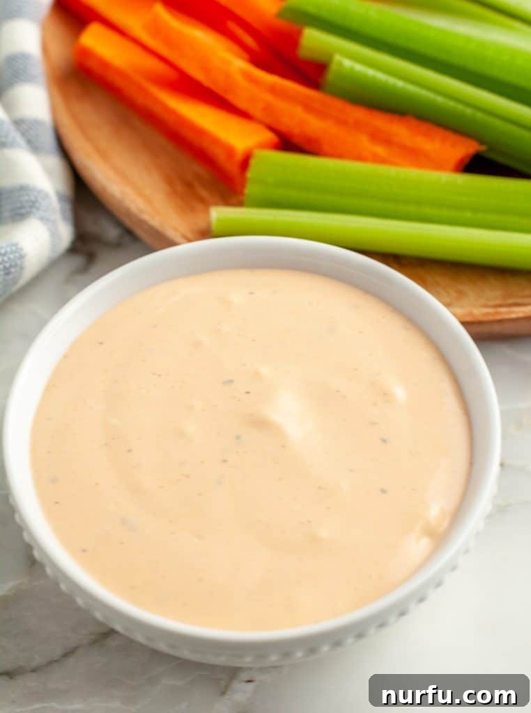 A bowl of creamy, homemade Buffalo Ranch dip, ready to be enjoyed with your favorite snacks or meals.