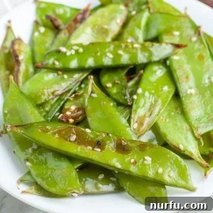 Plate of snow peas and sesame seeds.