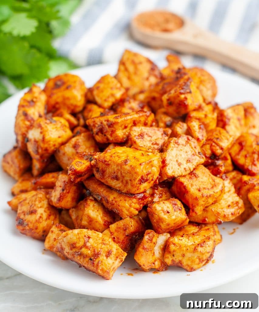 Unlock Irresistible Chicken Taco Flavor 2 Plate of perfectly diced and seasoned chicken ready for tacos.