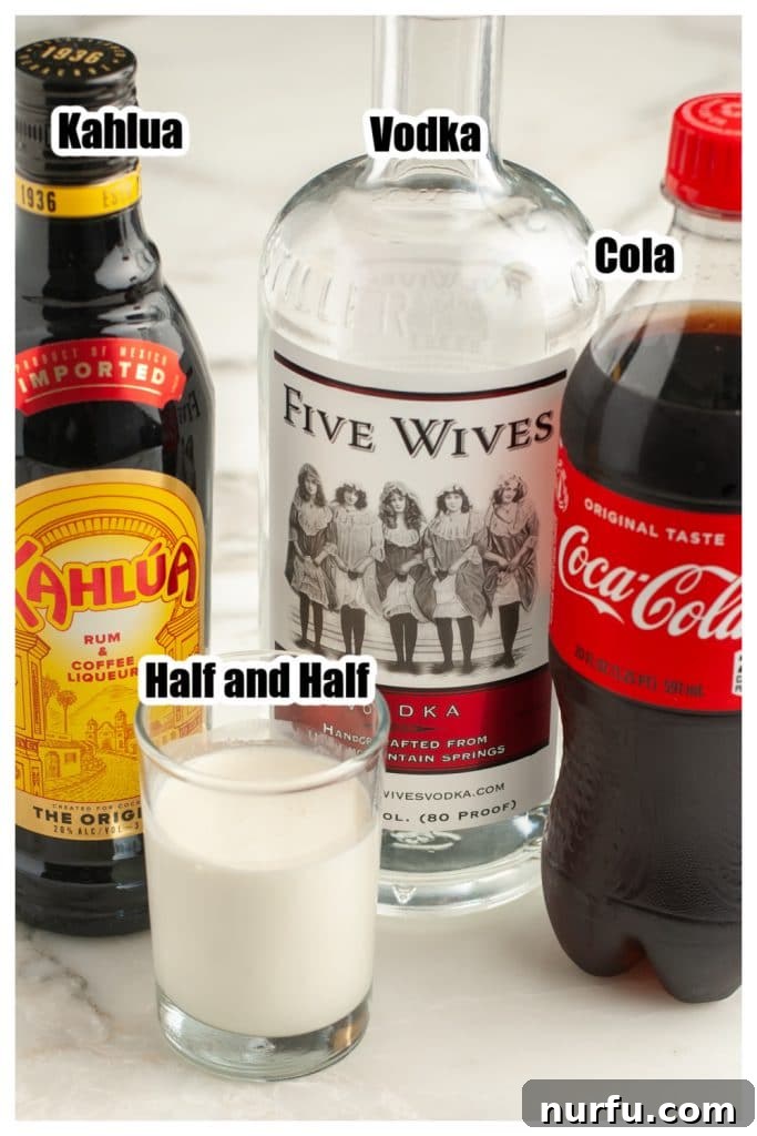 The Mile-High Bulldog 3 Individual ingredients for a Colorado Bulldog: Bottle of Kahlua, vodka, cola, and a carton of cream.