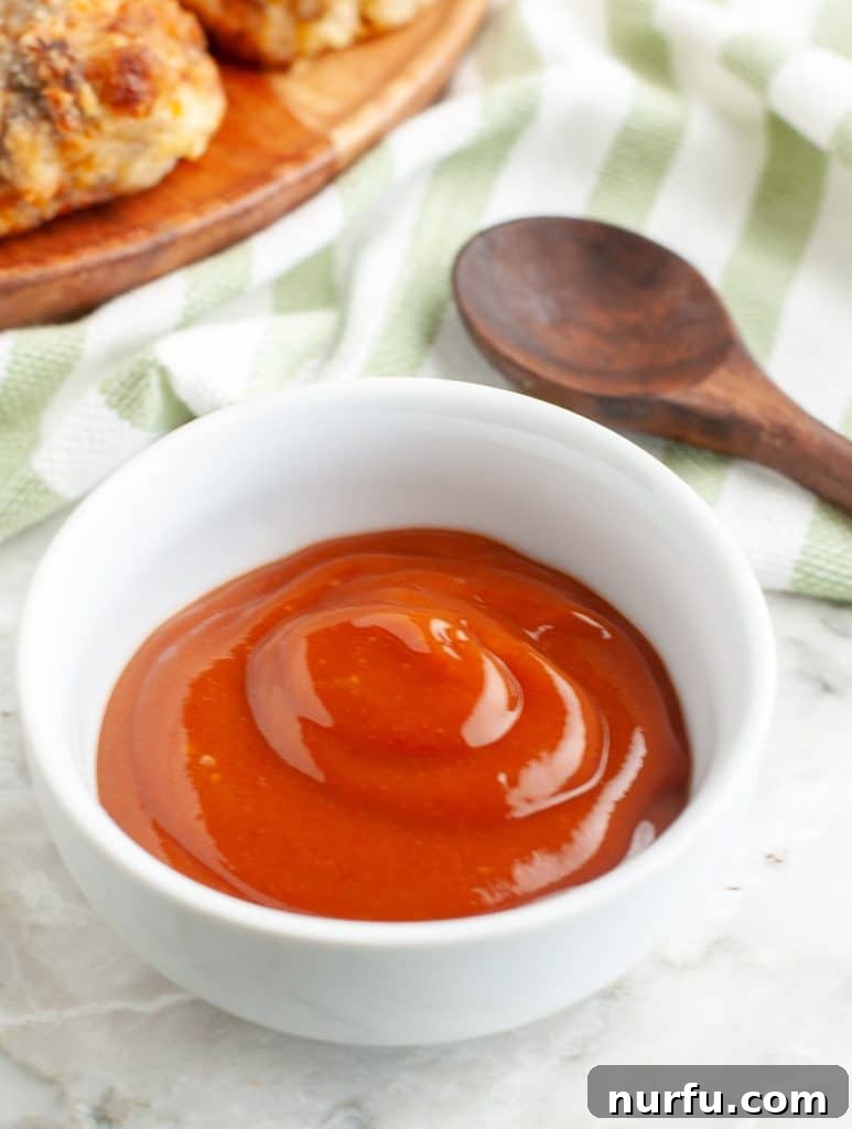 The Legendary Heinz 57 Steak Enhancer 4 A close-up view of the rich, red homemade Heinz 57 sauce served in a small white bowl, ready to enhance any meal.