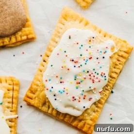 Homemade air fryer pop tarts with a flaky crust and sweet filling.