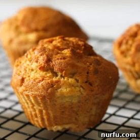 Moist and fluffy air fryer banana muffins, baked to golden perfection.