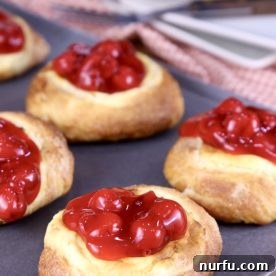Delicious cherry cheese danish pastries on a baking pan, fresh from the air fryer.