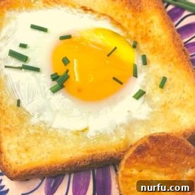 Classic air fryer toad in the hole, with an egg perfectly cooked within a slice of bread.