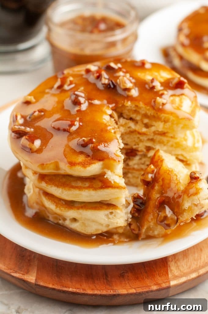 Gourmet Pecan Praline Pancakes 4 A beautifully stacked plate of pecan praline pancakes ready to be served.