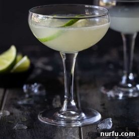A perfectly chilled classic Daiquiri cocktail, light and refreshing, ready to be enjoyed.