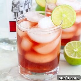 Vibrant cranberry vodka cocktail served in a glass, highlighting its deep red color.