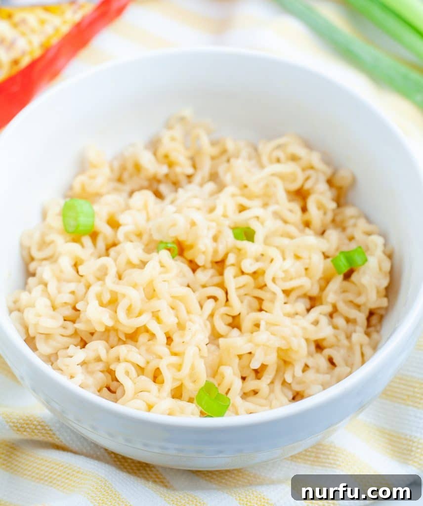 Perfecting Microwave Ramen 2 A steaming bowl of perfectly cooked ramen noodles in a microwave-safe bowl, ready to be enjoyed.