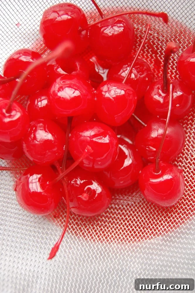 Bowl of Maraschino Cherries A vibrant bowl of glistening maraschino cherries, ready to be used in baking