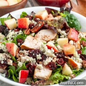Bowl of salad with chicken.