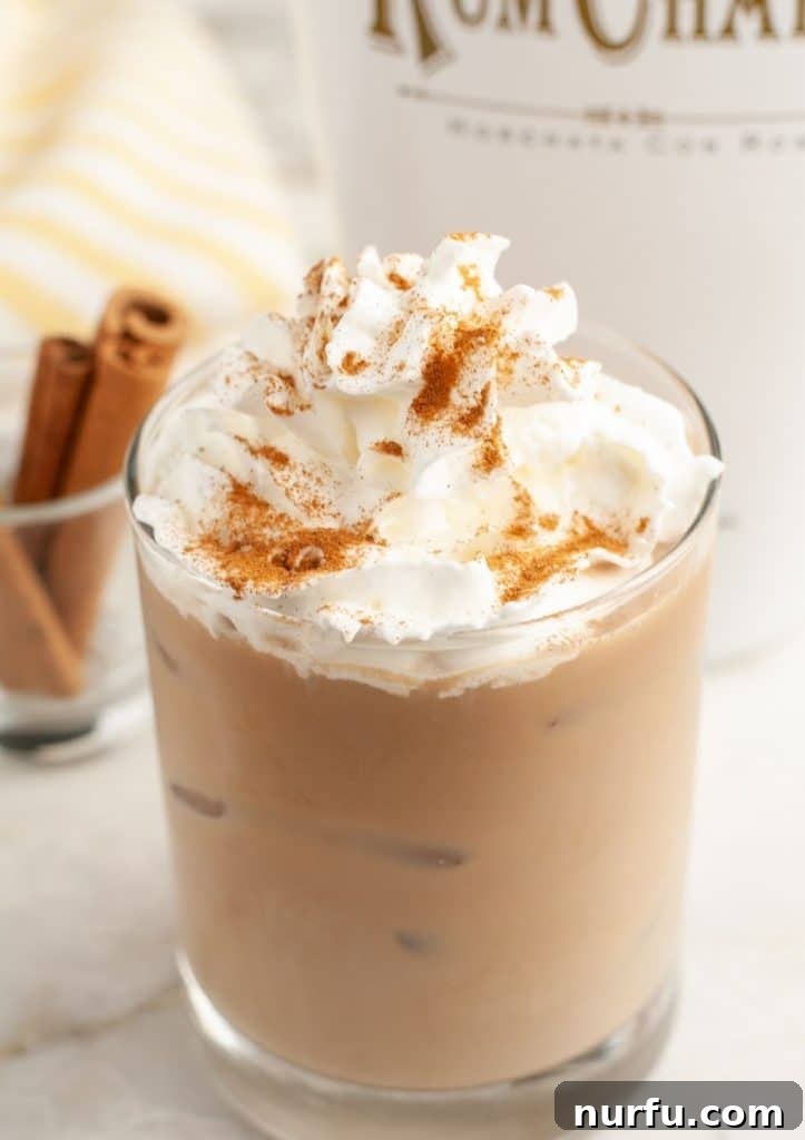 Iced coffee and whipped cream in glass.