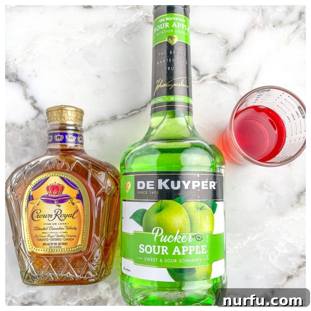 Signature Washington Apple Shot 3 Bottles of Crown Royal, sour apple schnapps, and cranberry juice, the key ingredients for a Washington Apple Shot.