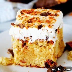 An edge piece of Butterfinger Cake, rich and crumbly.