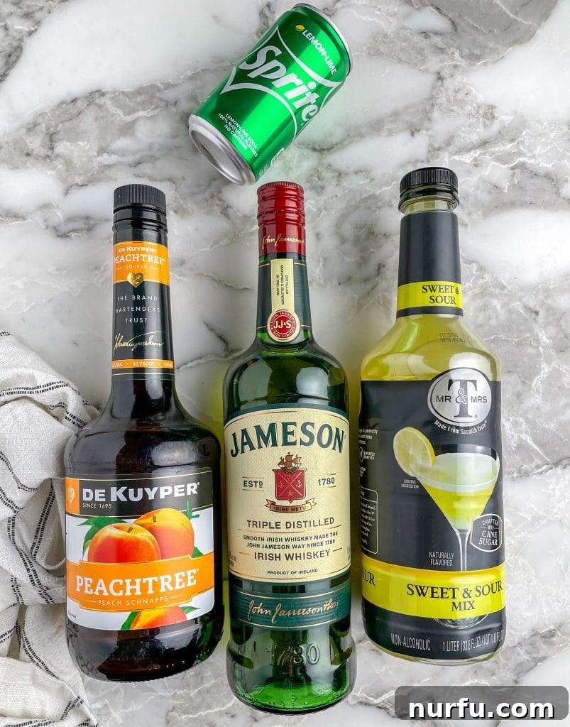 Your Guide to Green Tea Shots 3 Individual bottles of Jameson Irish whiskey, peach schnapps, sour mix, and a can of lemon-lime soda, laid out as ingredients for a Green Tea Shot.