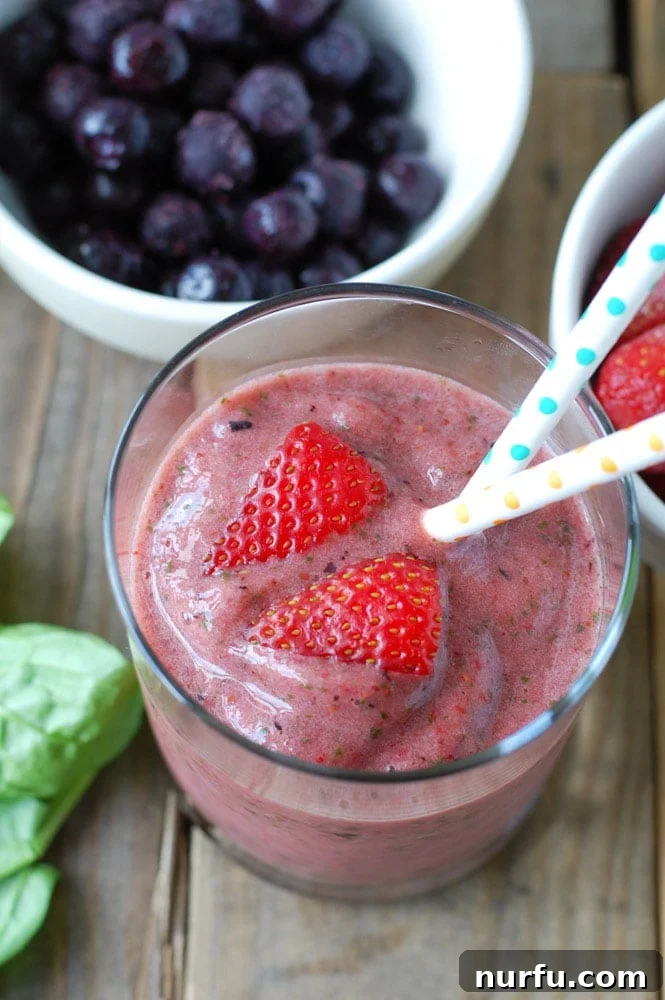 Freezer Smoothie Pack A vibrant glass of strawberry smoothie, beautifully garnished and ready to be enjoyed, highlighting a quick and healthy breakfast option.