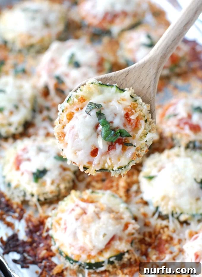 Cheesy Baked Zucchini Parmesan 4 Sheet pan of Zucchini Parmesan straight from the oven, bubbling cheese and golden brown edges.