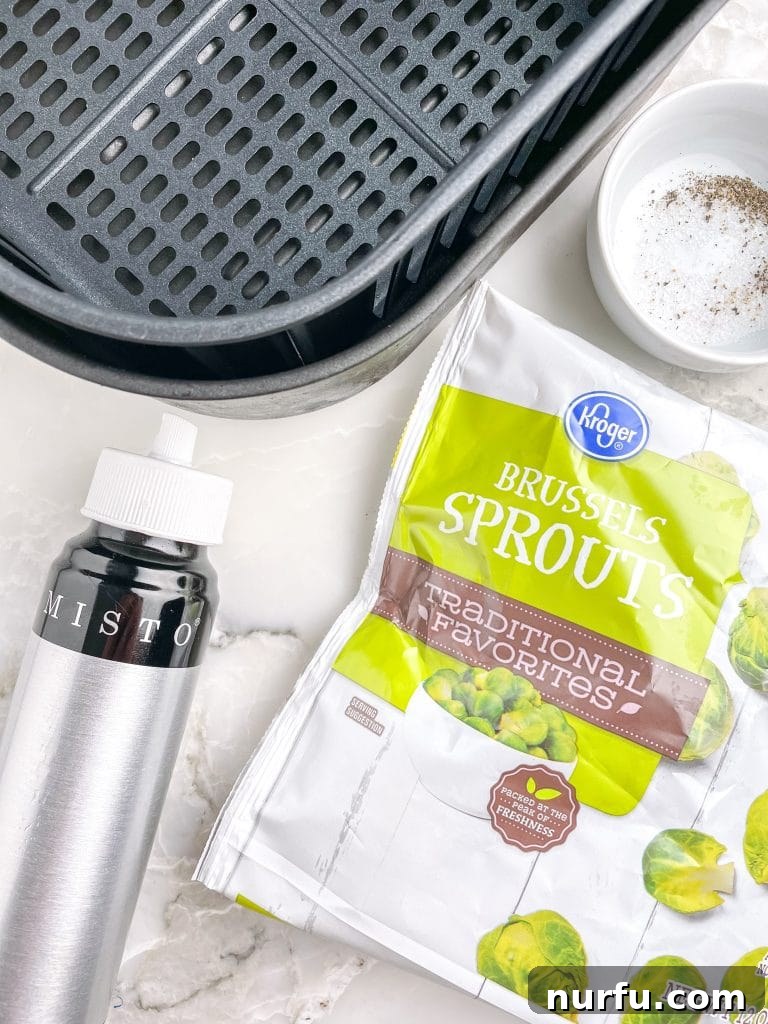 Crispy Air Fryer Frozen Brussels Sprouts Made Easy 3 Air fryer basket, oil mister, and a bag of frozen brussels sprouts – all you need for this recipe.