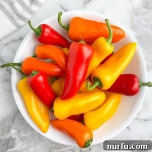 21 Bite Sized Sweet Pepper Delights 3 Bowl of red, yellow, and orange mini peppers, ready for roasting.