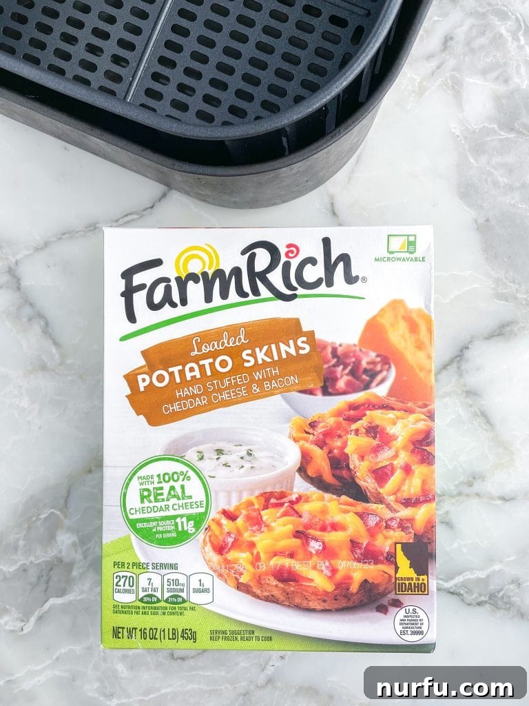 From Frozen to Fabulous: Air Fryer Potato Skins 3 A box of frozen potato skins displayed next to an open air fryer basket, symbolizing readiness for a quick and delicious cooking session.