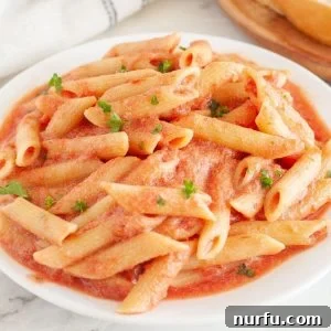 Plate of pasta with blush sauce.
