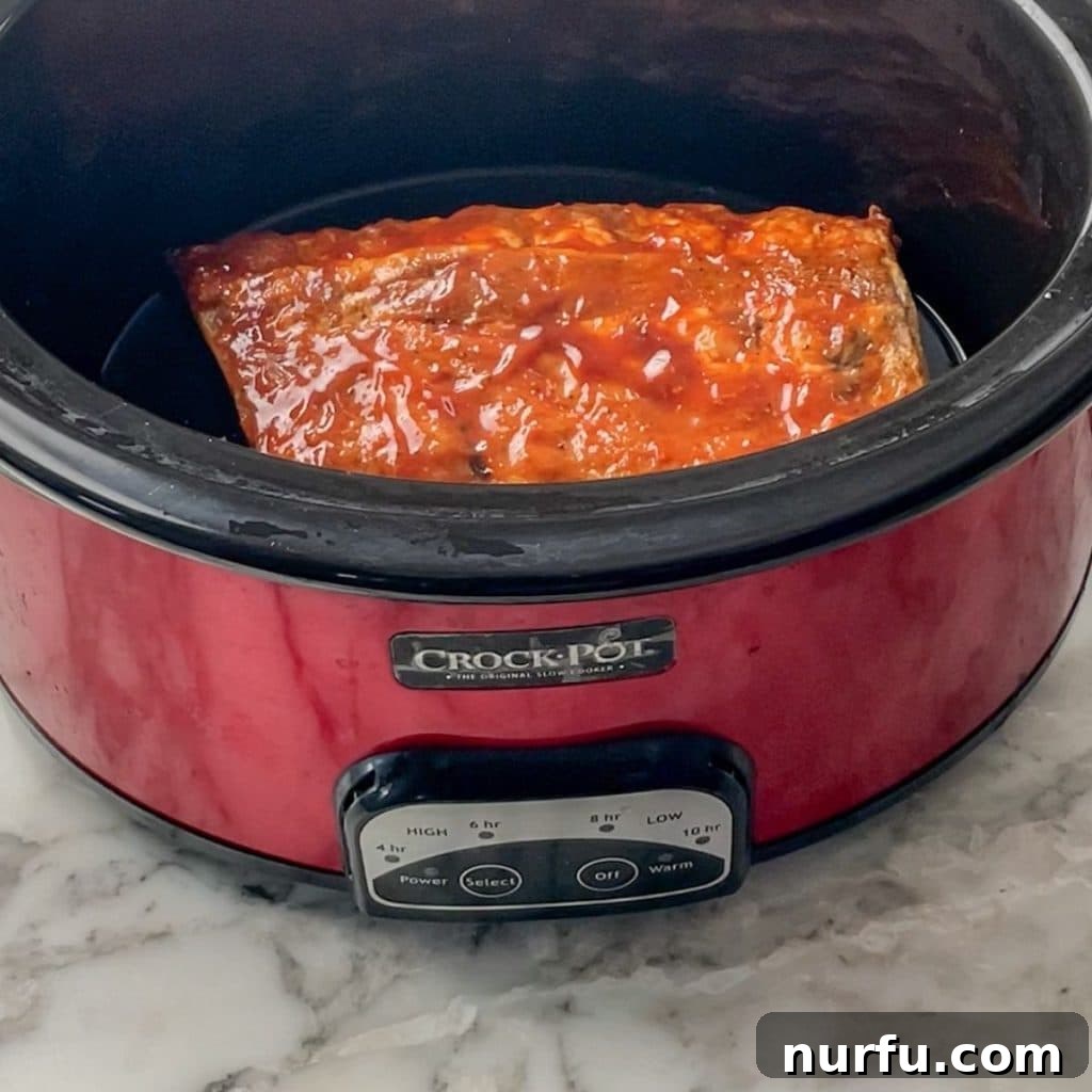 How To Reheat Ribs in Slow Cooker Cooked ribs in a slow cooker, ready for gentle, moist reheating.