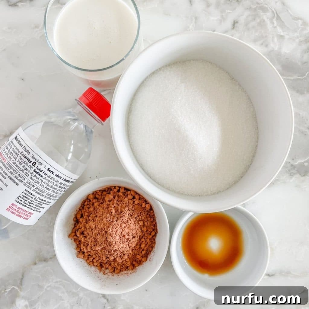 Velvet Chocolate Cream Soda 3 Bowls of sugar and unsweetened cocoa powder, along with bottles of vanilla extract, half and half, and soda water, laid out as ingredients for chocolate Italian cream soda.