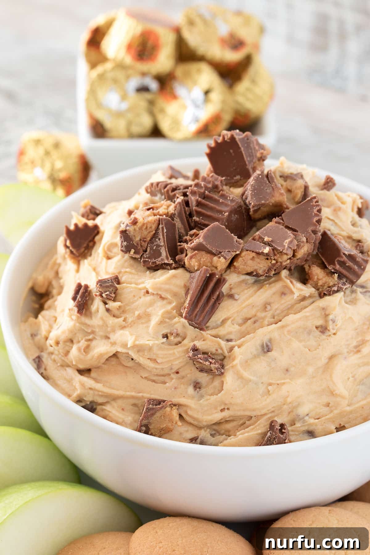 15 Next-Level Dips for Your Best Party Yet 13 Decadent Peanut Butter Cup Cheesecake Dip, a sweet treat for parties.