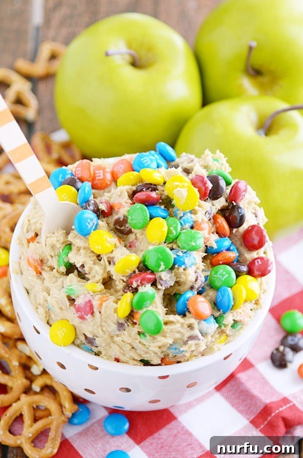 15 Next-Level Dips for Your Best Party Yet 14 Fun and colorful Monster Cookie Dough Dip, a delightful dessert appetizer.