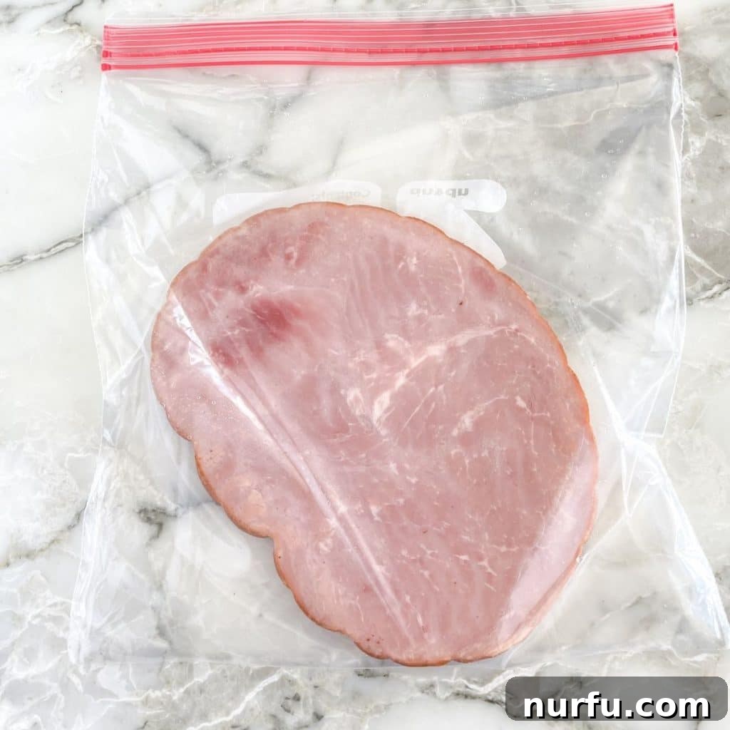 Ham Freezing Demystified: Store, Thaw, and Reheat Safely 3 Frozen diced ham in a freezer-safe bag, ready for storage.