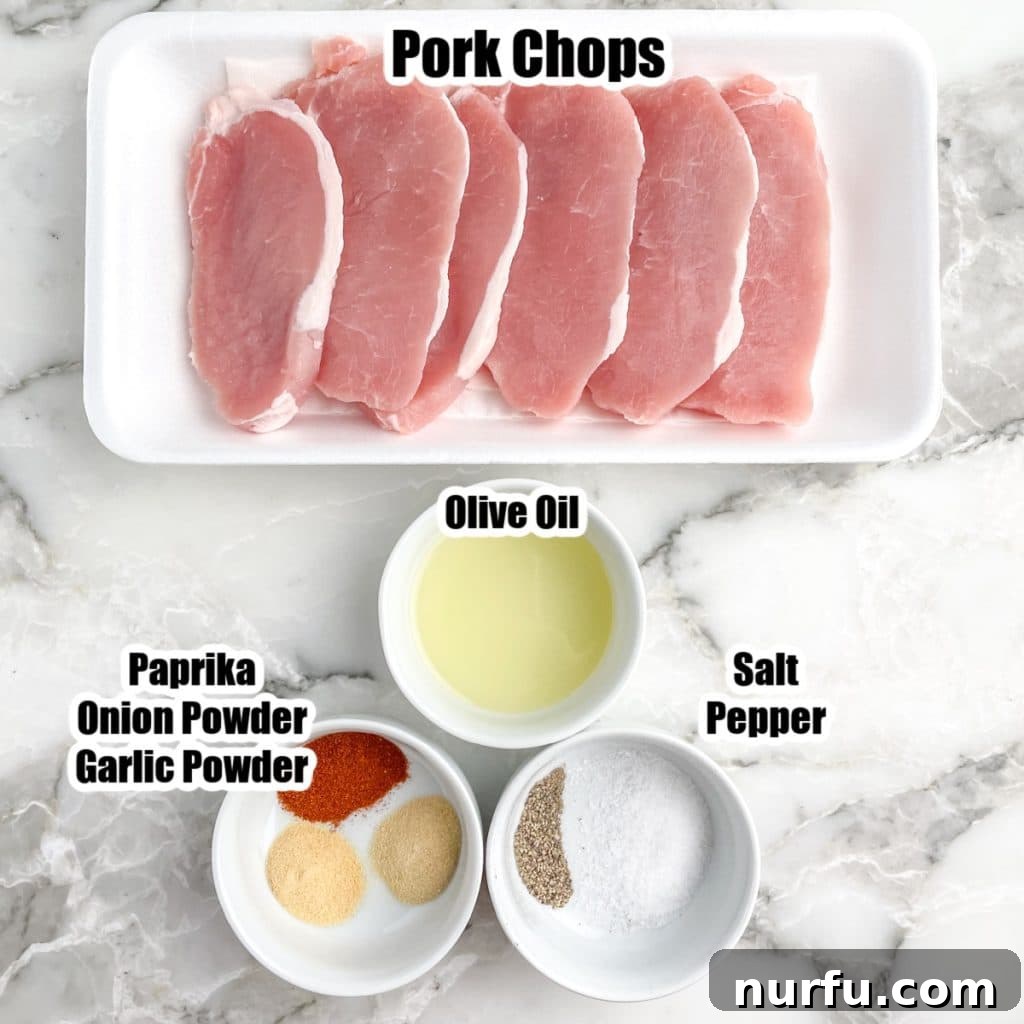 Quick Bake Pork Chops 375 Degrees Perfect Time 3 Pork chops arranged in a baking dish next to a small bowl of olive oil and a mixture of seasonings, ready for preparation.