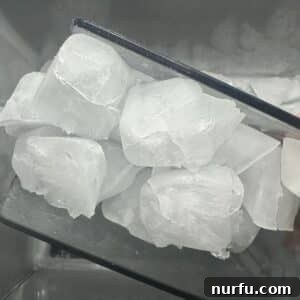 Water's Freezing Journey Uncovered 5 Scoop of ice cubes